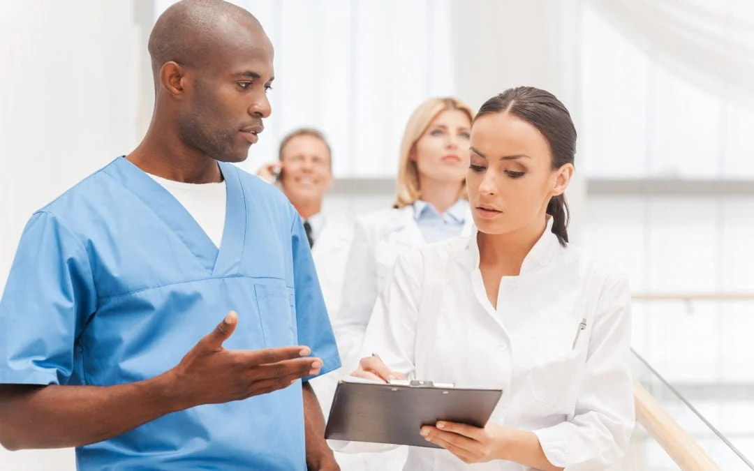 medical staffs discussing EMR